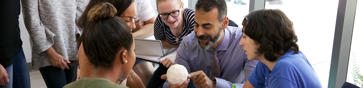 Professor Katsioloudis & ODU students work together in a classroom inside the new education building.