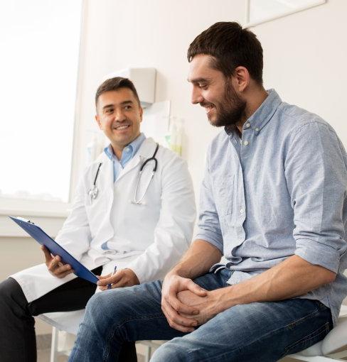 two men sitting in doctors office